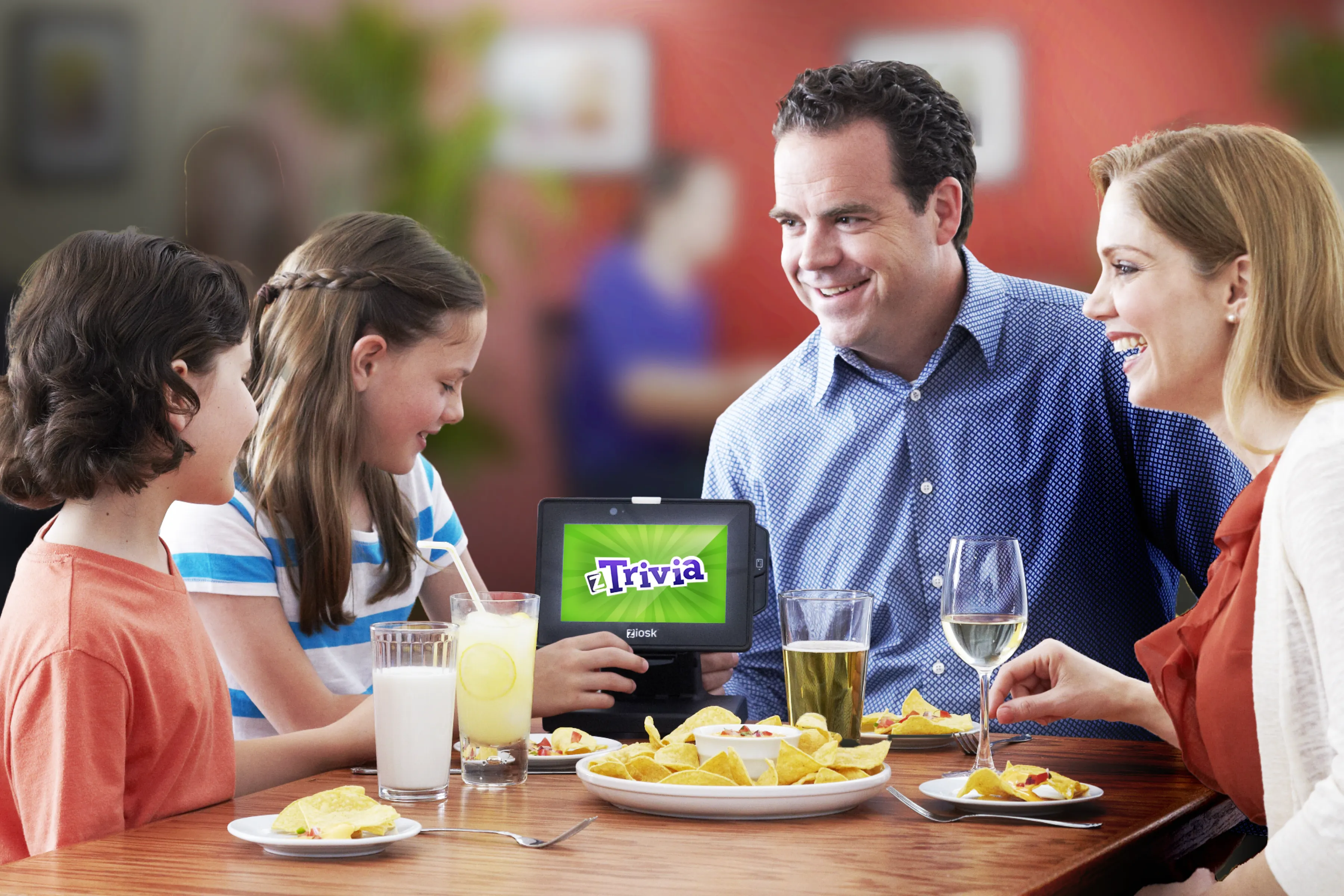 zTrivia — family playing at restaurant table